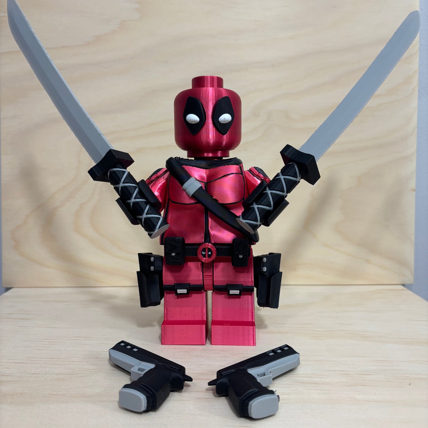 3D printed Deadpool Brickman Figure with removable katanas and dual pistols.