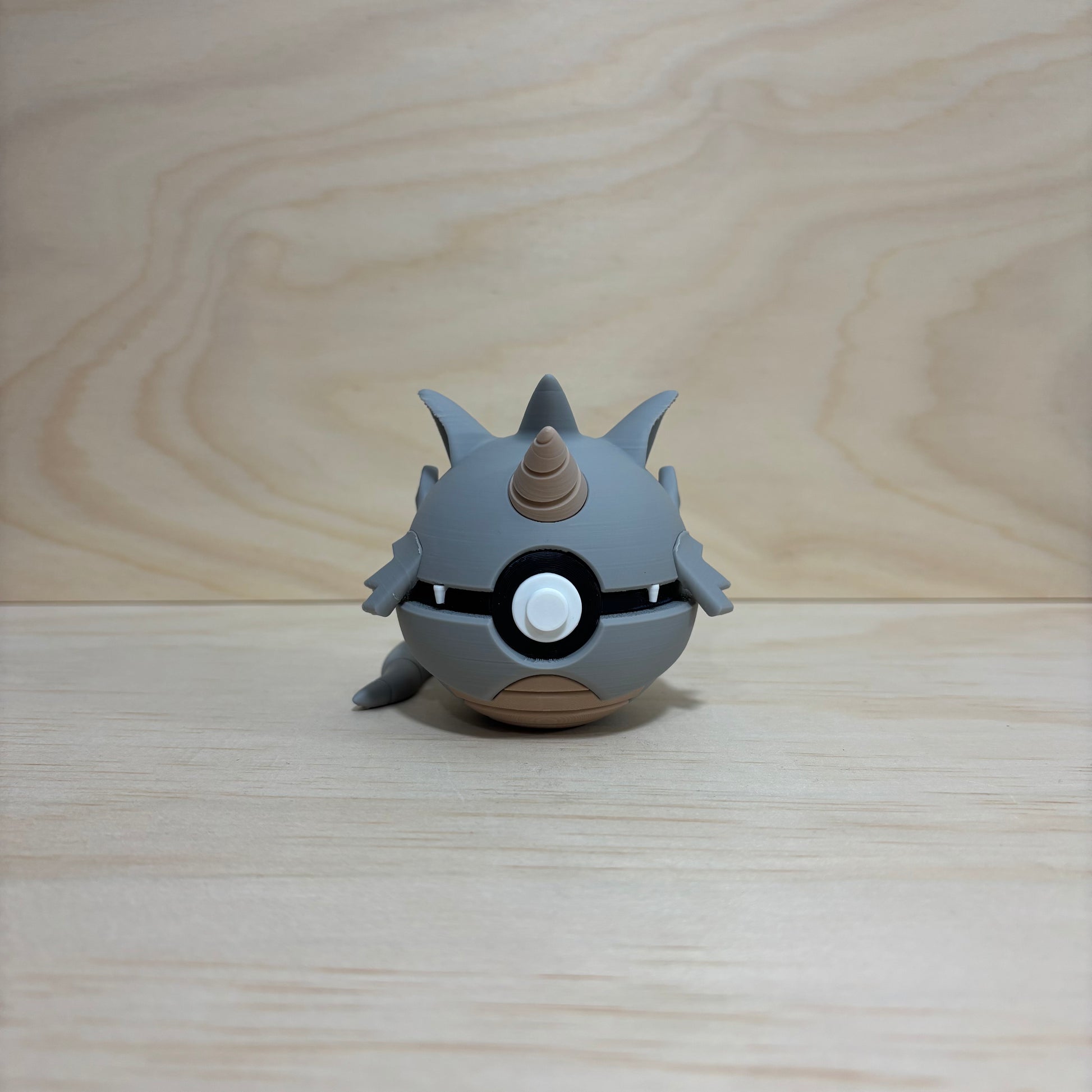 3D printed #0112 Rhydon Poké Ball collectible featuring Rhydon hidden inside an opening Poké Ball.