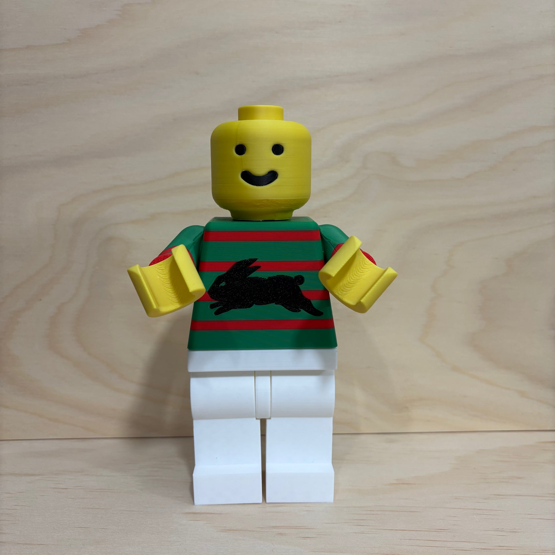 3D printed South Sydney Rabbitohs NRL Brickman Figure wearing the club's home jersey.