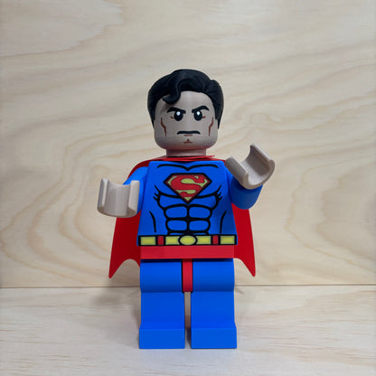 3D printed Superman Brickman Figure wearing the classic blue suit and red cape.