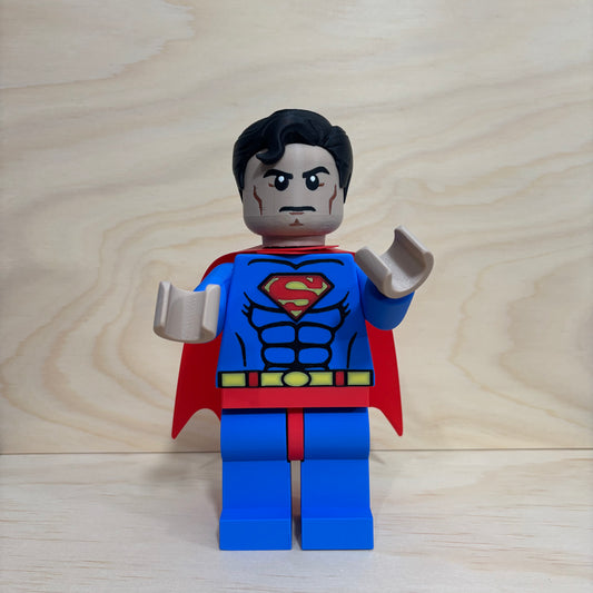 3D printed Superman Brickman Figure wearing the classic blue suit and red cape.