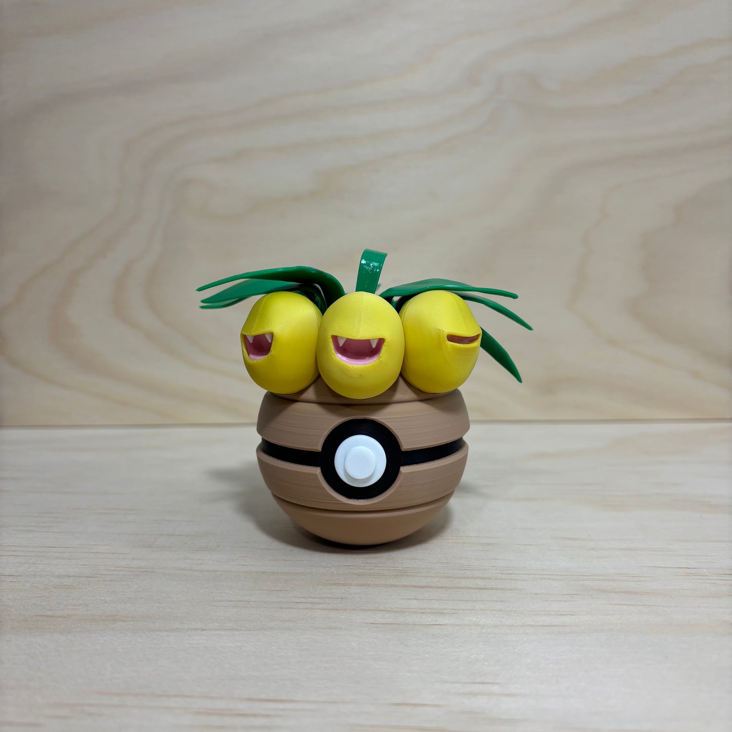 3D printed #0103 Exeggutor Poké Ball collectible featuring Exeggutor hidden inside an opening Poké Ball.