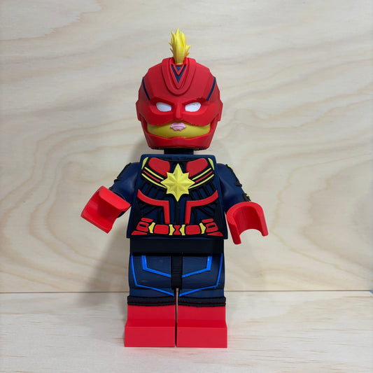 3D printed Captain Marvel Brickman Figure wearing the iconic red, blue and gold suit with mohawk helmet.