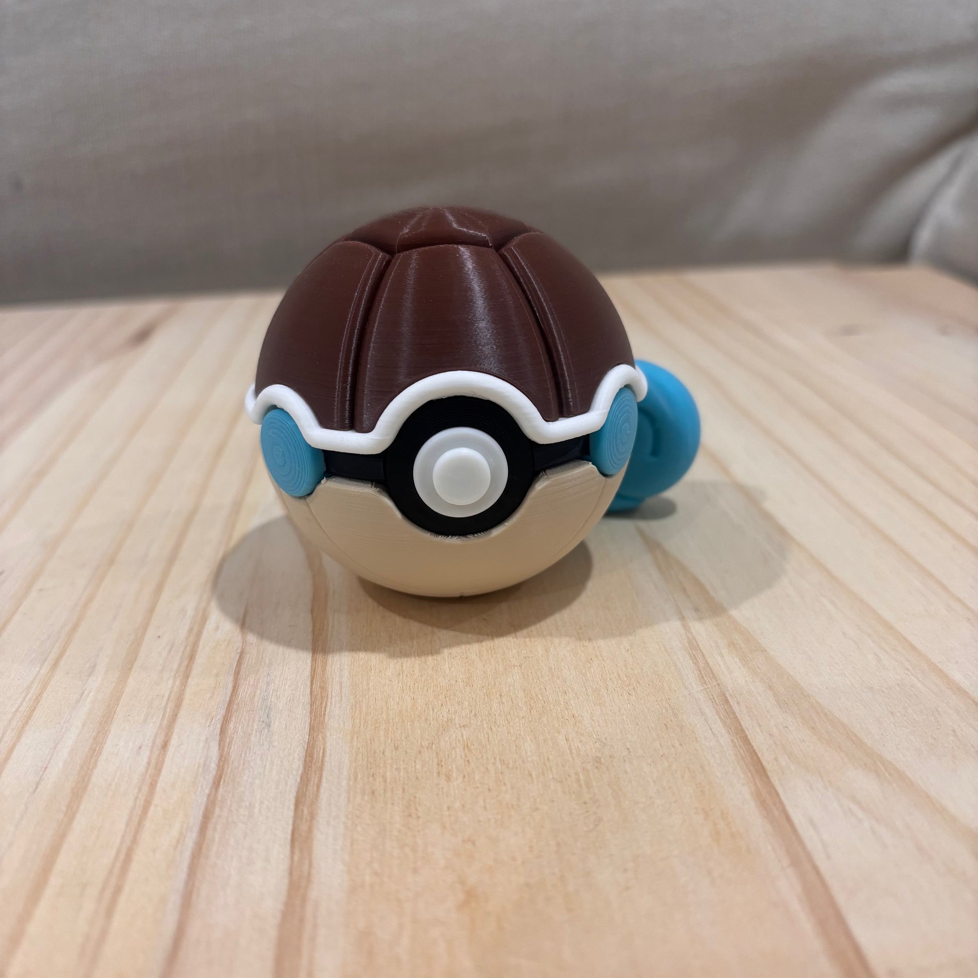 3D printed 0007 Squirtle Poké Ball collectible inspired by Squirtle with blue tail, shell and Water-type design.