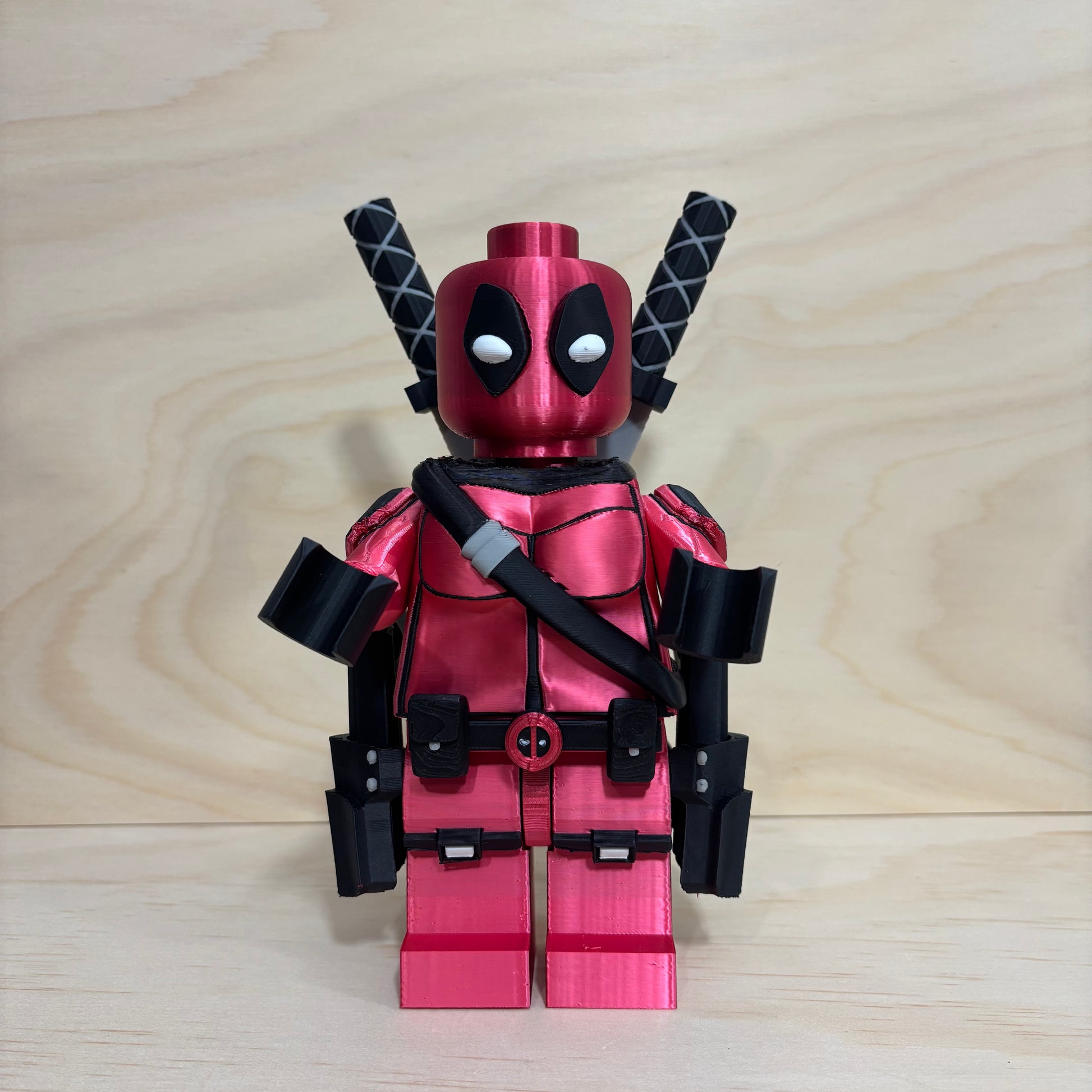 3D printed Deadpool Brickman Figure with removable katanas and dual pistols.