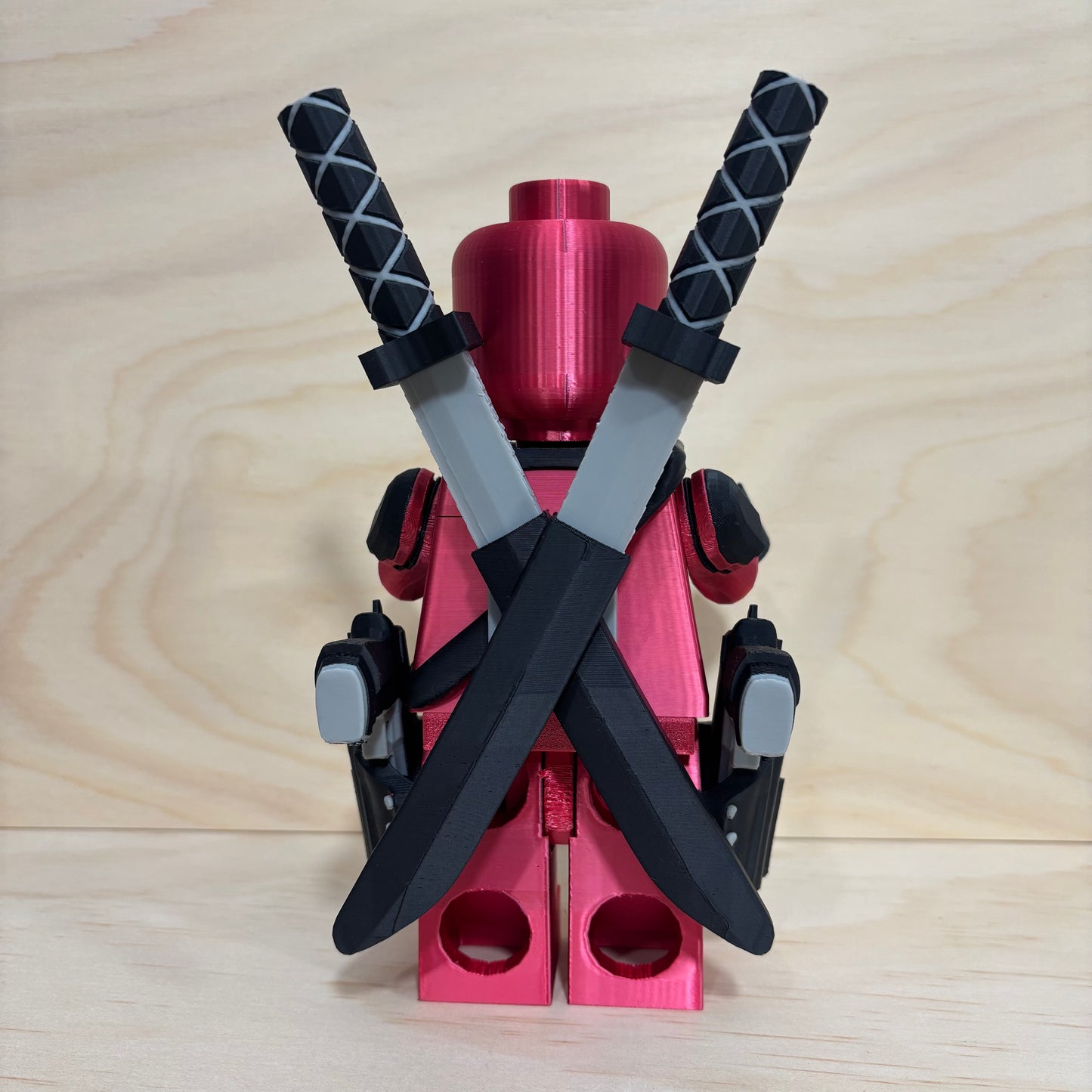 3D printed Deadpool Brickman Figure with removable katanas and dual pistols.