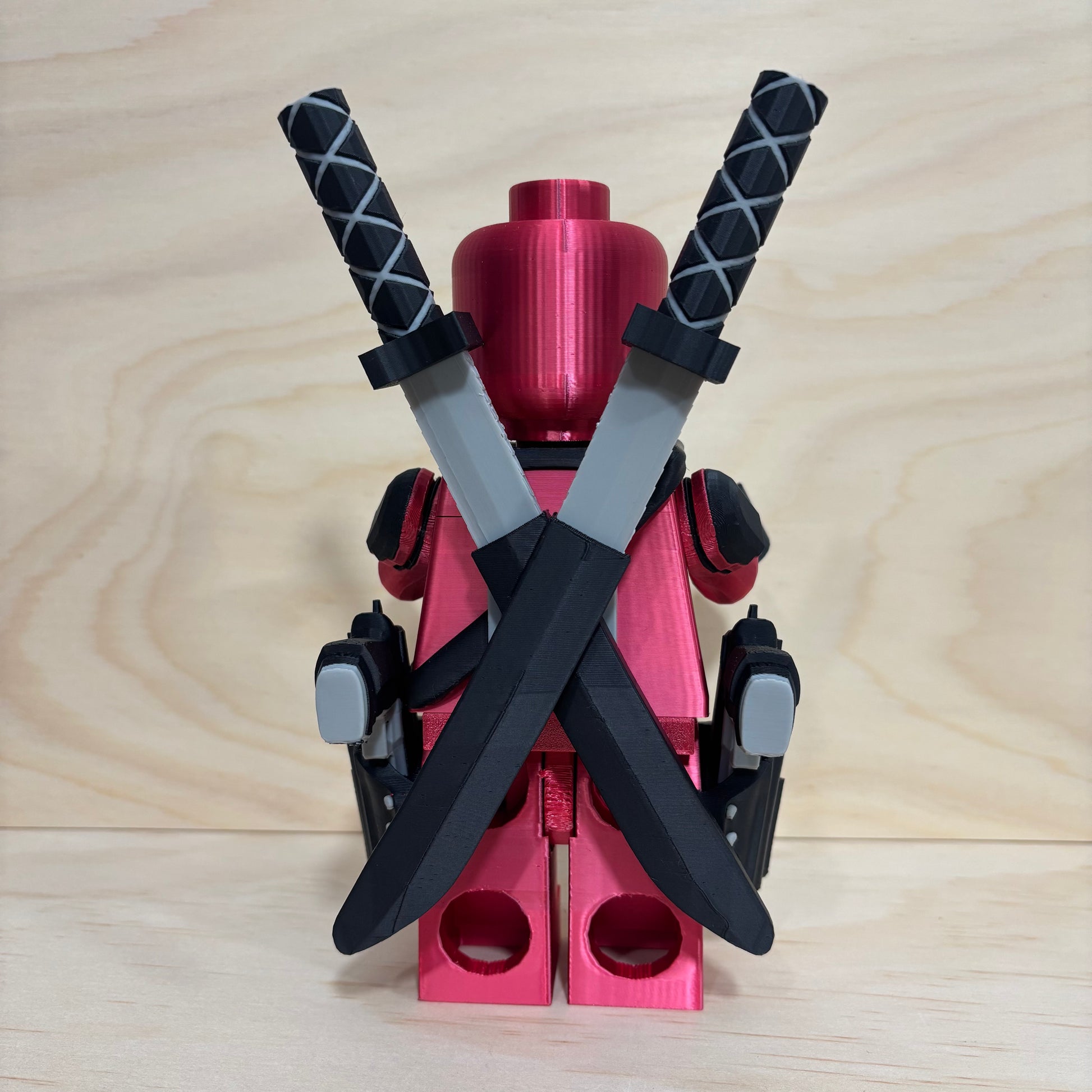 3D printed Deadpool Brickman Figure with removable katanas and dual pistols.