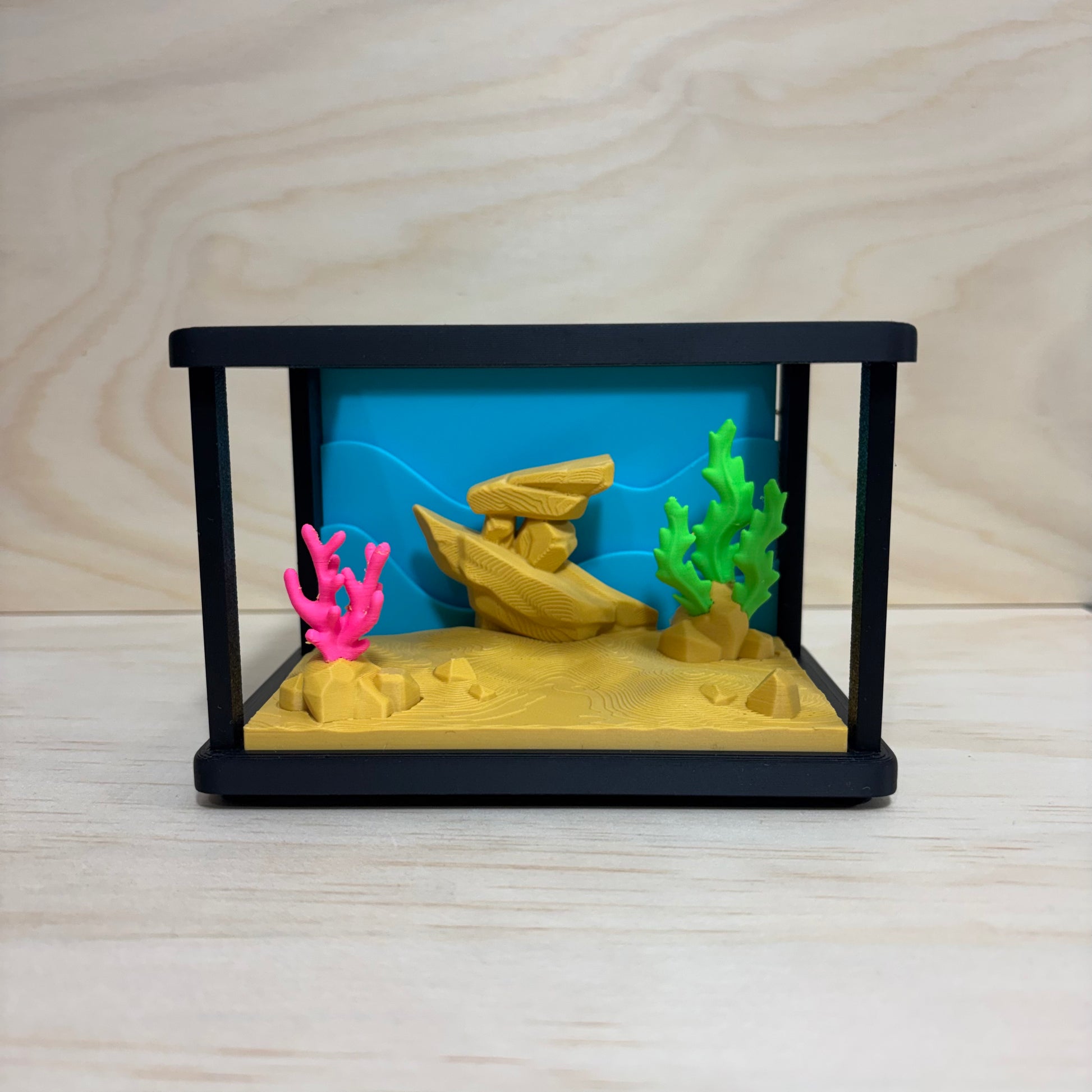 3D printed Mini Pal Aquarium Adventure play set featuring a miniature aquarium with coral, a shipwreck and three colourful flexi fish.