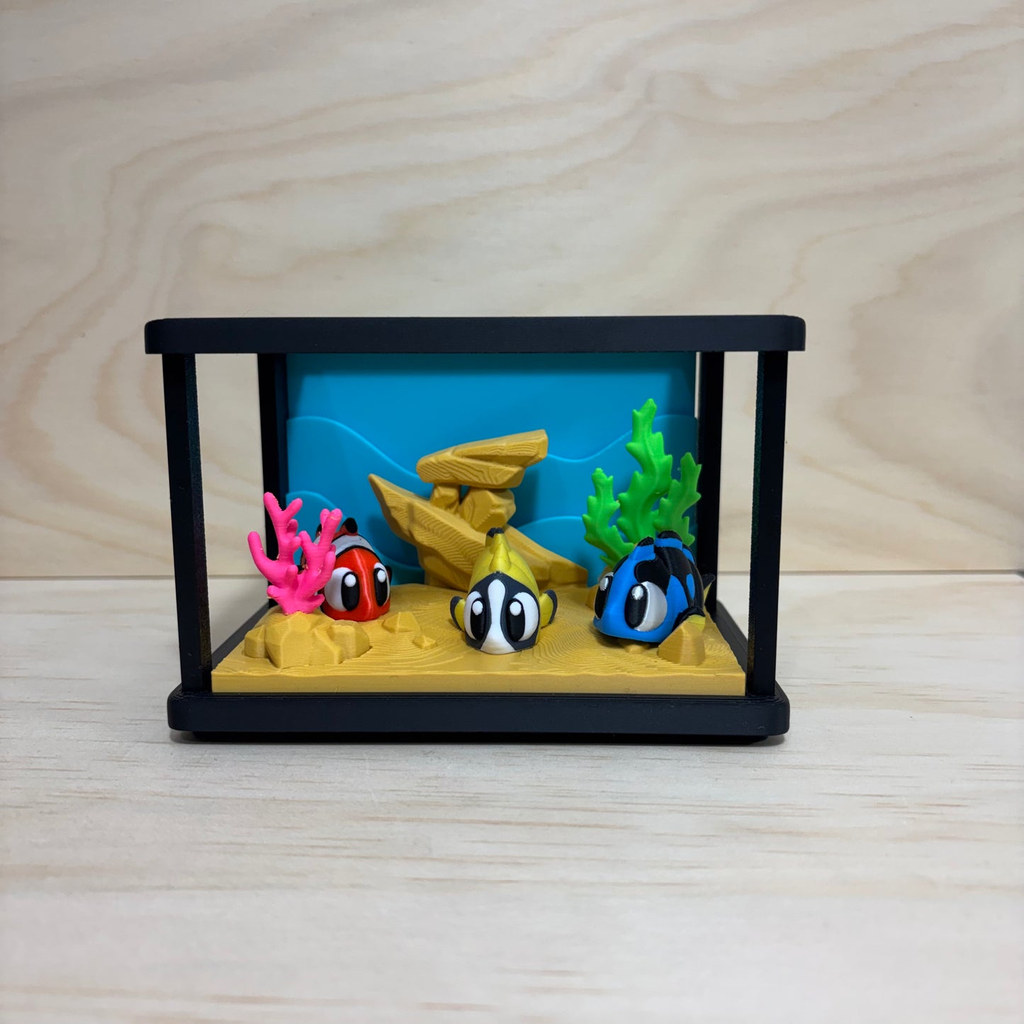 3D printed Mini Pal Aquarium Adventure play set featuring a miniature aquarium with coral, a shipwreck and three colourful flexi fish.