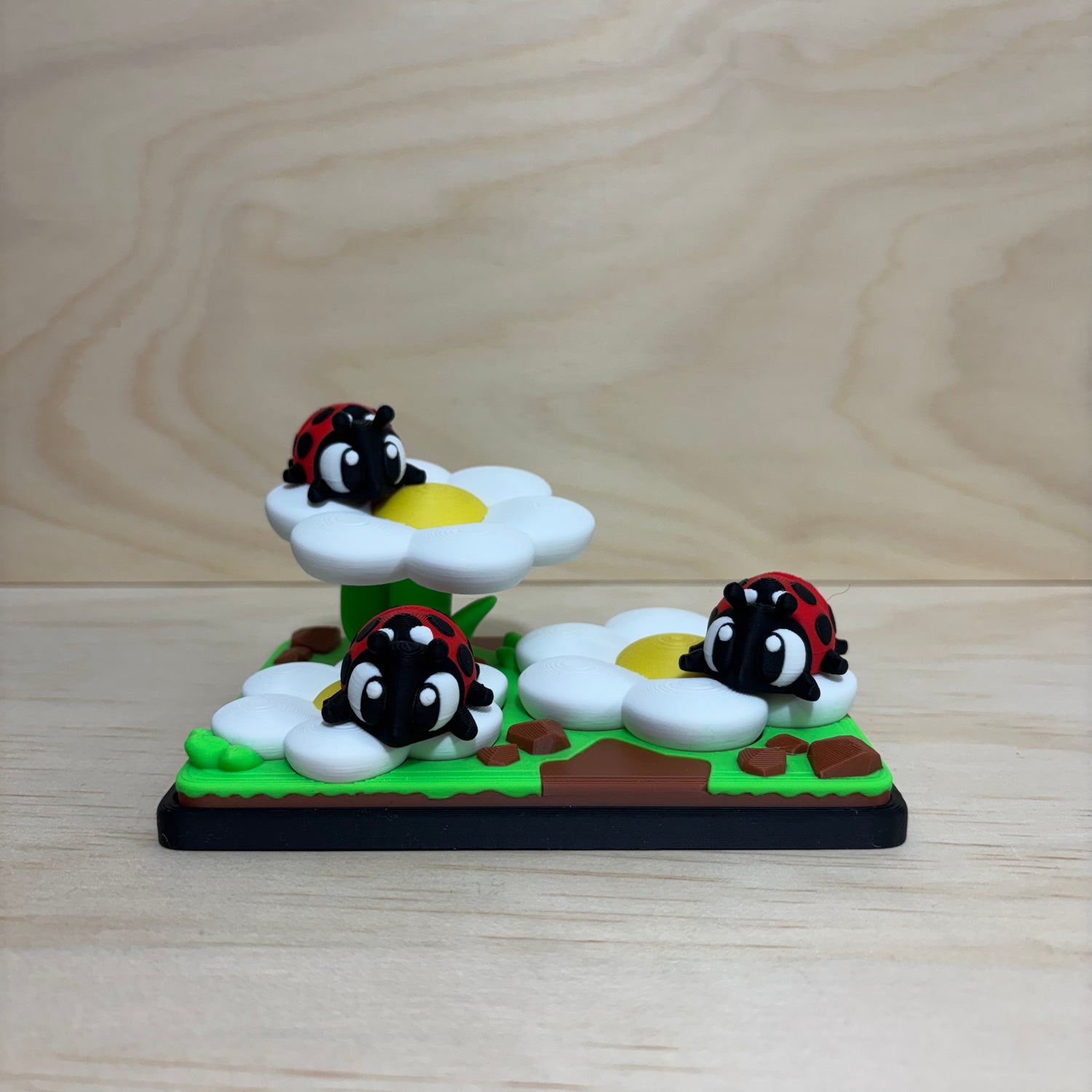 3D printed Mini Pal Ladybug Garden play set featuring three flexi ladybugs on colourful flowers.