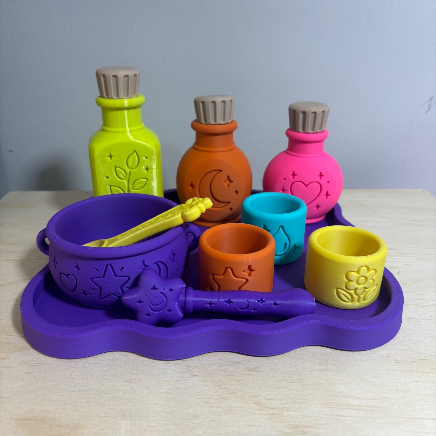 Colourful 3D printed Potion Play Set with potion bottles, mixing bowl, spoon, ingredient cups and purple tray